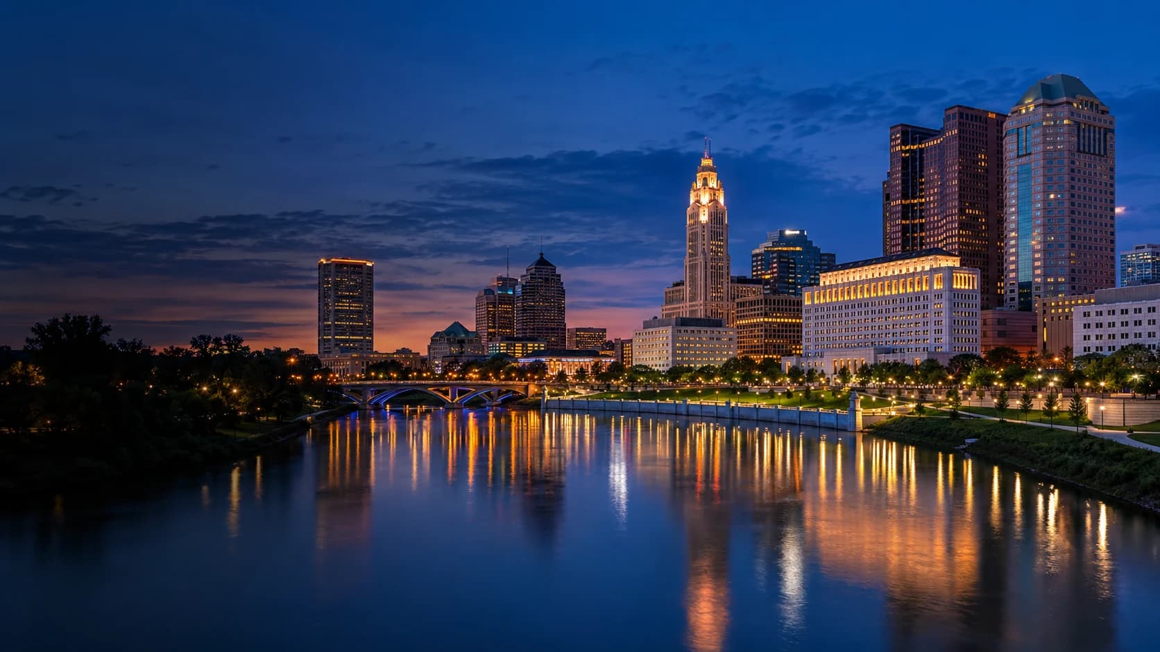 Columbus skyline and the Scioto River at blue hour