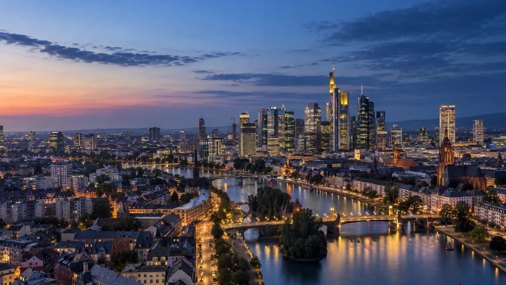 Frankfurt skyline and the Main river at blue hour