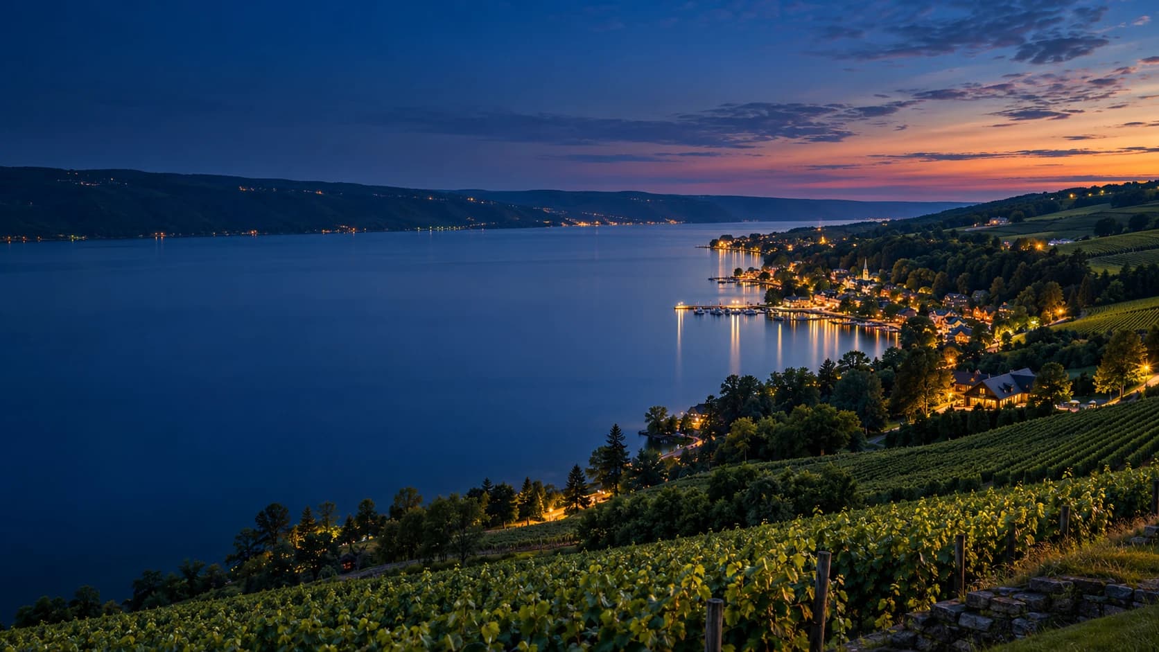 The Finger Lakes shoreline and vineyards at blue hour