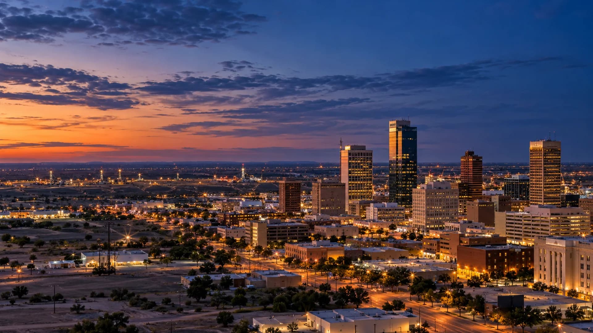 Midland skyline and the West Texas plains at blue hour