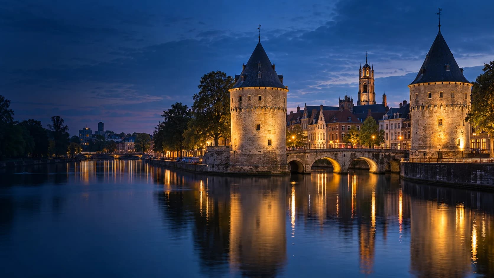 Kortrijk and the Broel Towers beside the River Leie at blue hour