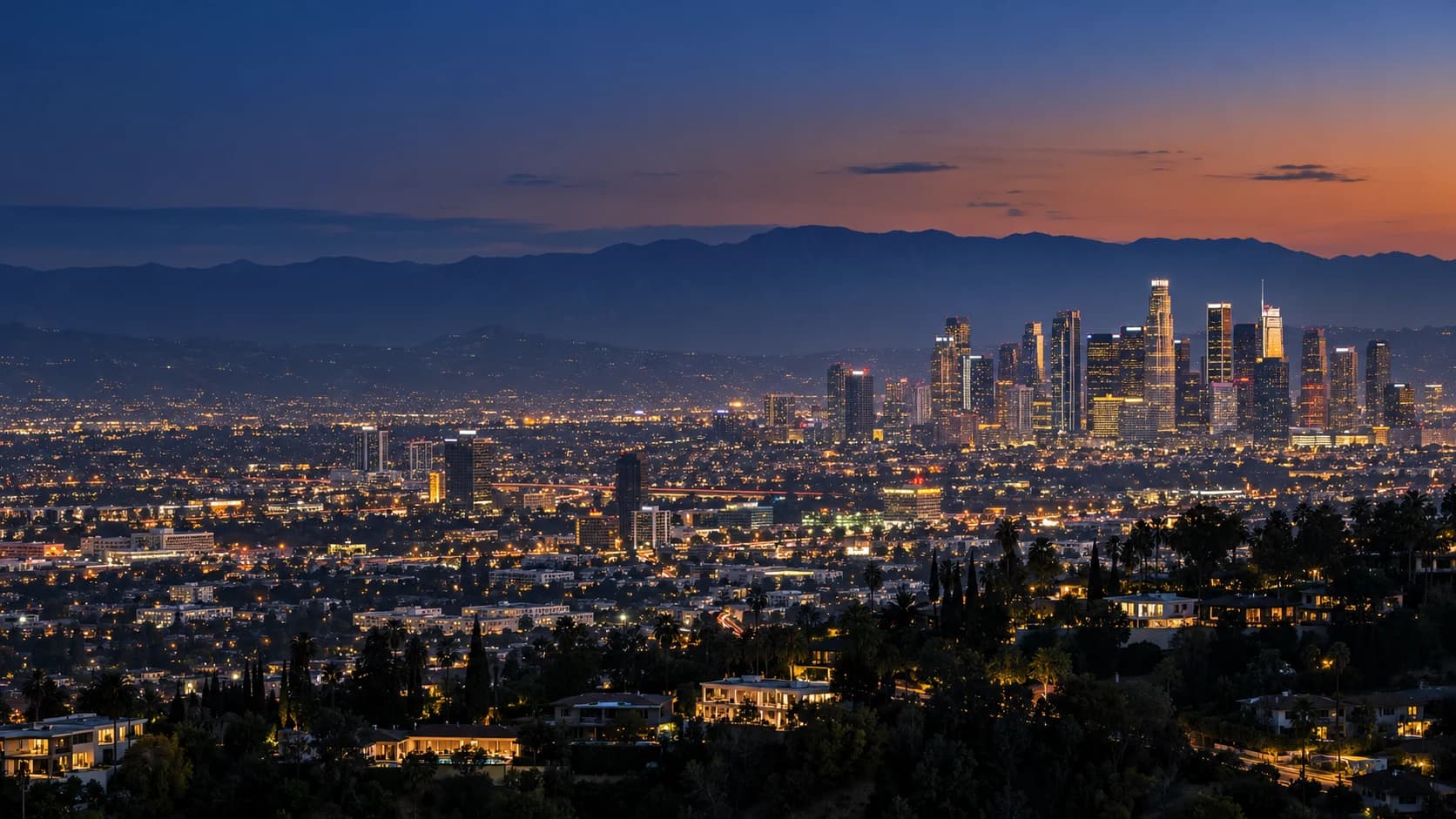 Los Angeles skyline and the San Gabriel Mountains at blue hour